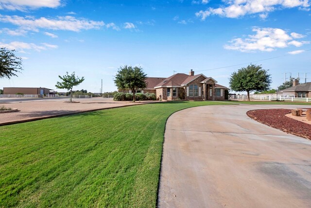 10104 E County Rd 103, Midland, TX 79706 - single story home featuring curved driveway and a chimney