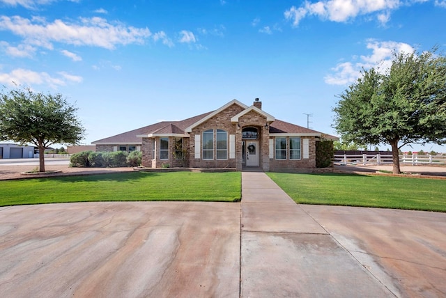 10104 E County Rd 103, Midland, TX 79706 - view of front facade with a chimney and brick siding