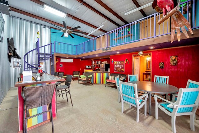 10104 E County Rd 103, Midland, TX 79706 - dining space with an AC wall unit, high vaulted ceiling, ceiling fan, and stairway