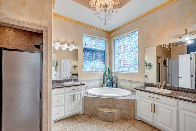 10104 E County Rd 103, Midland, TX 79706 - full bathroom featuring a chandelier, tile patterned floors, two vanities, a shower stall, and a garden tub