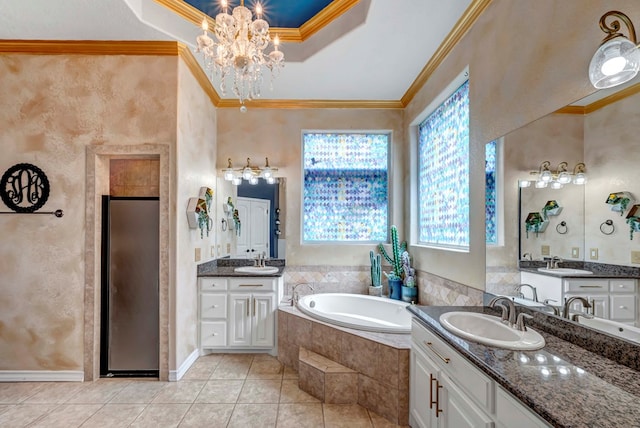 10104 E County Rd 103, Midland, TX 79706 - bathroom with tile patterned floors, a garden tub, a stall shower, two vanities, and ornamental molding