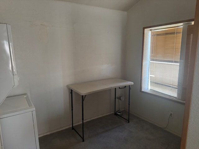 901 N D St, Midland, TX 79701 - laundry room with stacked washer and clothes dryer and dark carpet
