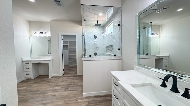 13223 E County Rd 110, Midland, TX 79706 - full bath featuring a stall shower, wood finished floors, a spacious closet, recessed lighting, and baseboards