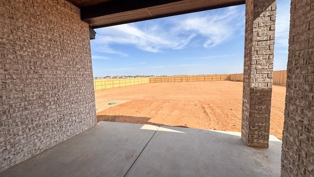 13223 E County Rd 110, Midland, TX 79706 - fenced backyard with a patio