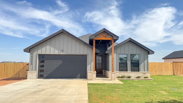 13223 E County Rd 110, Midland, TX 79706 - view of front of home with board and batten siding, a garage, and concrete driveway