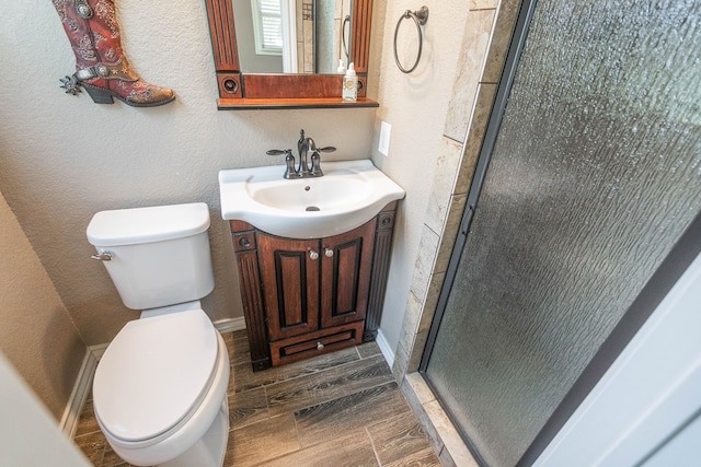 2205 Boyd Ave, Midland, TX 79705 - bathroom with vanity, a stall shower, and a textured wall