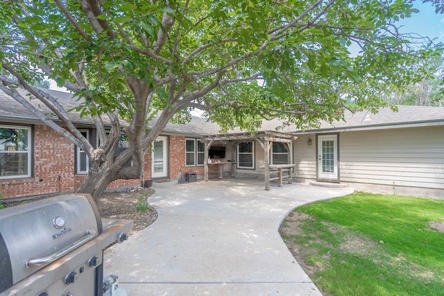 2205 Boyd Ave, Midland, TX 79705 - rear view of house with a pergola, a patio area, and brick siding