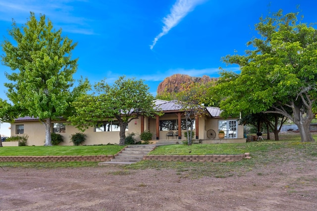 ranch-style house with a front yard