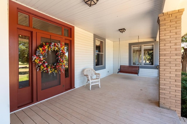 wooden terrace with a porch