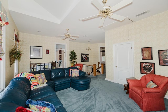 carpeted living area featuring ceiling fan, visible vents, vaulted ceiling, and wallpapered walls