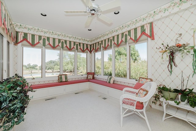 sunroom / solarium featuring ceiling fan and visible vents