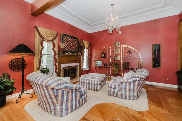 living area featuring a glass covered fireplace, a notable chandelier, beamed ceiling, and baseboards