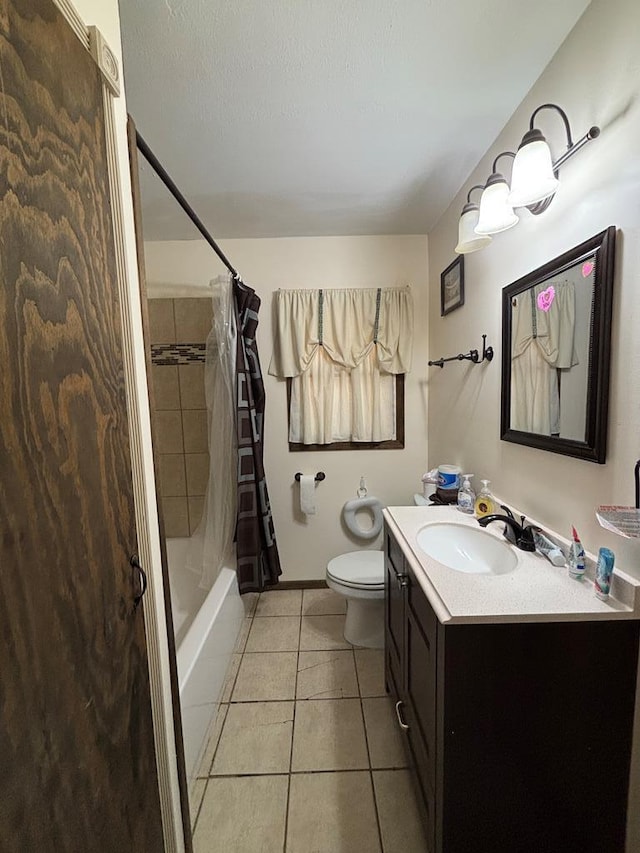 3103 Hill Ave, Snyder, TX 79549 - bathroom with vanity, tile patterned flooring, toilet, shower / tub combo with curtain, and baseboards
