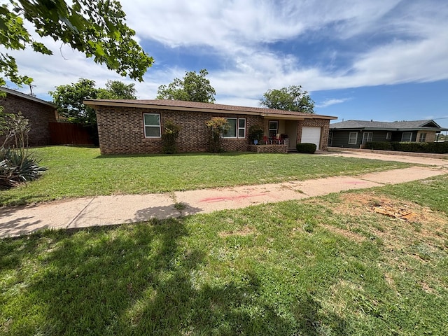 3103 Hill Ave, Snyder, TX 79549 - ranch-style house with concrete driveway, an attached garage, and brick siding