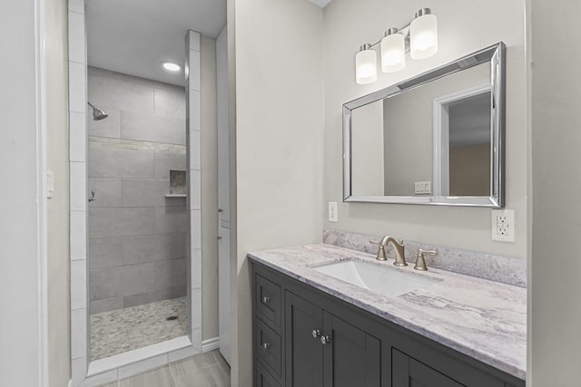 306 S Moss Lake Rd, Big Spring, TX 79720 - bathroom with tiled shower and vanity