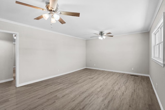 306 S Moss Lake Rd, Big Spring, TX 79720 - empty room with ceiling fan, wood finished floors, and ornamental molding