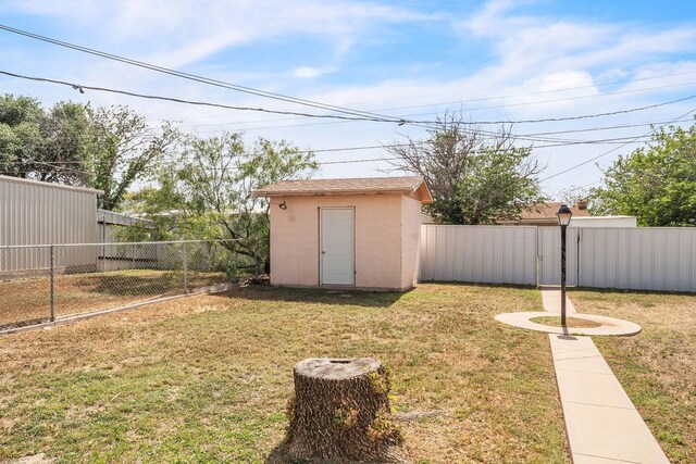 2502 Ann Dr, Big Spring, TX 79720 - view of yard with a storage shed and an outbuilding