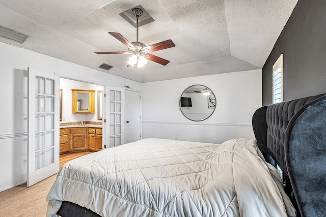 bedroom with visible vents, a textured ceiling, and french doors