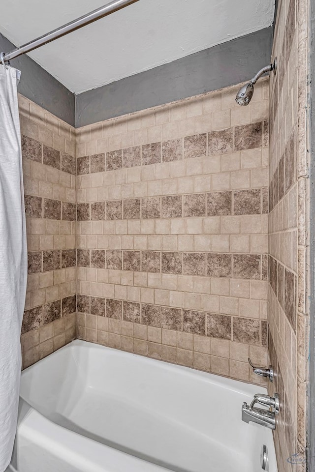 bathroom with shower / tub combo with curtain