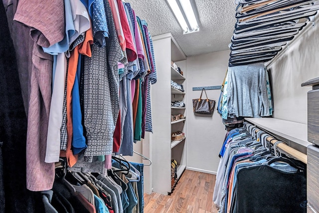 spacious closet with wood finished floors