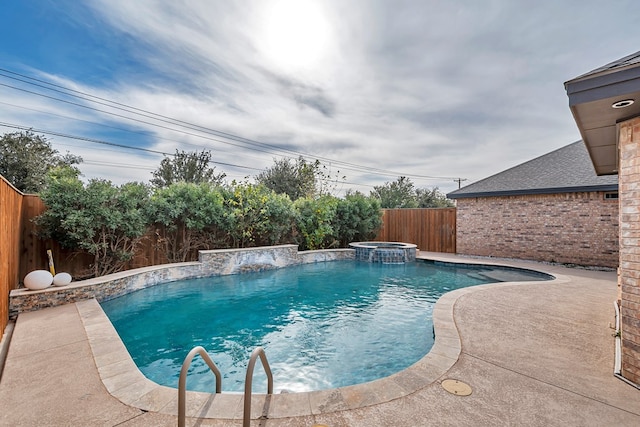 view of swimming pool with an in ground hot tub and a patio area