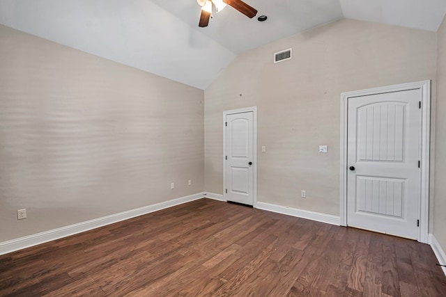 unfurnished bedroom with high vaulted ceiling, dark hardwood / wood-style floors, and ceiling fan