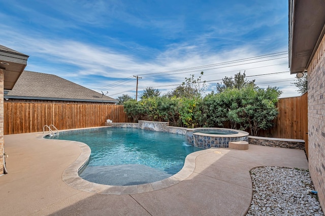 view of pool featuring an in ground hot tub, pool water feature, and a patio