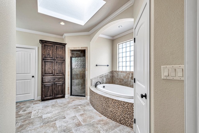 bathroom featuring crown molding and separate shower and tub