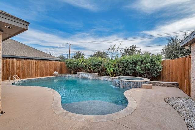 view of pool featuring a patio, pool water feature, and an in ground hot tub