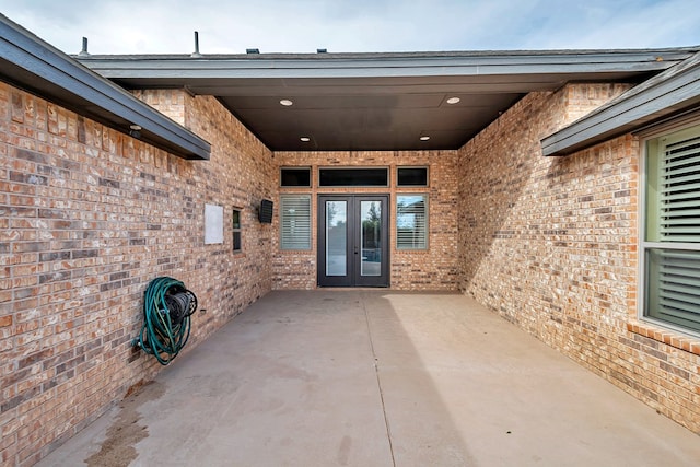 doorway to property featuring french doors and a patio area