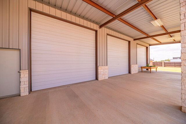 garage featuring wood walls