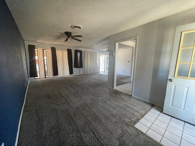 4705 Ric Dr, Midland, TX 79703 - spare room with a ceiling fan, light colored carpet, a textured ceiling, and light tile patterned floors
