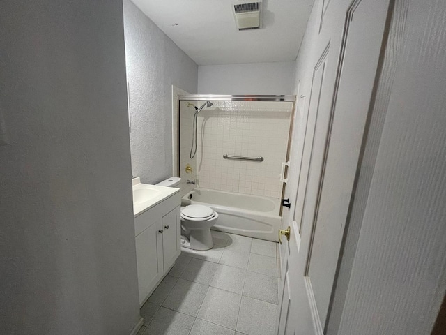 4705 Ric Dr, Midland, TX 79703 - bathroom featuring a textured wall, tile patterned flooring, toilet, vanity, and shower / tub combination