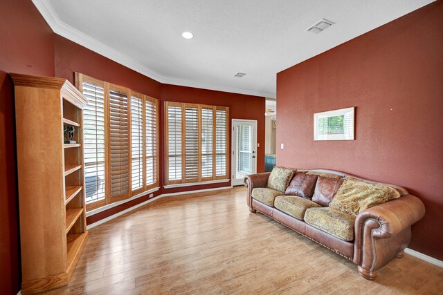 5810 Sterling Pl, Midland, TX 79707 - living area featuring crown molding, wood finished floors, and baseboards