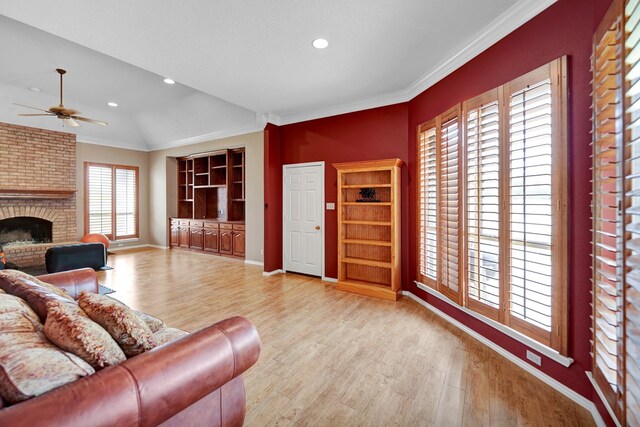 5810 Sterling Pl, Midland, TX 79707 - living area featuring a ceiling fan, wood finished floors, recessed lighting, baseboards, and a fireplace