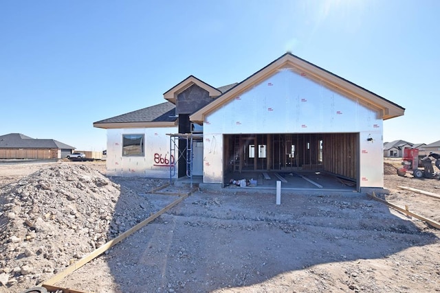 property in mid-construction with a garage