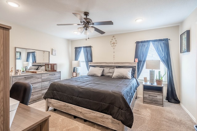 carpeted bedroom with ceiling fan