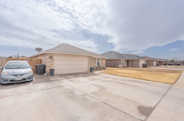 view of home's exterior with a yard and a garage