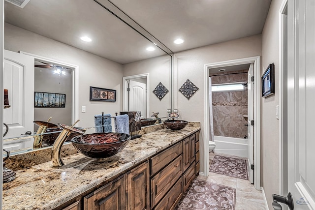 full bath with toilet, recessed lighting, shower / bath combination with curtain, and double vanity