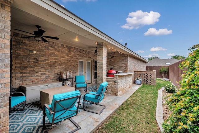 view of patio / terrace with a fenced backyard and a ceiling fan
