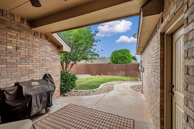 view of patio with a ceiling fan and a fenced backyard