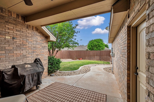 view of patio featuring ceiling fan and a fenced backyard