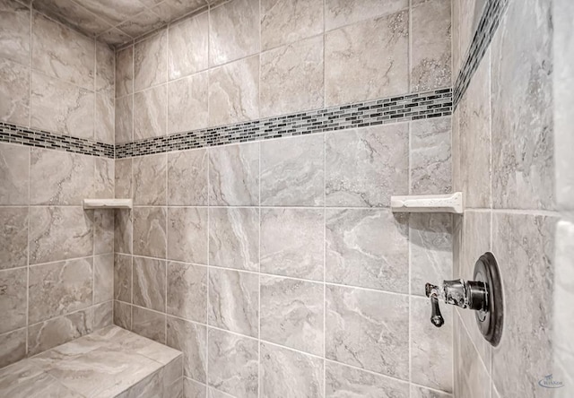 full bath featuring tiled shower