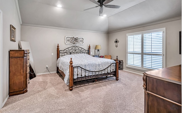 bedroom with lofted ceiling, crown molding, carpet flooring, and baseboards