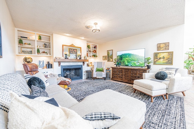 3615 W Wadley Ave, Midland, TX 79707 - living area with a textured ceiling, a fireplace, and built in shelves