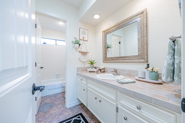 3615 W Wadley Ave, Midland, TX 79707 - full bathroom featuring vanity and shower / tub combination