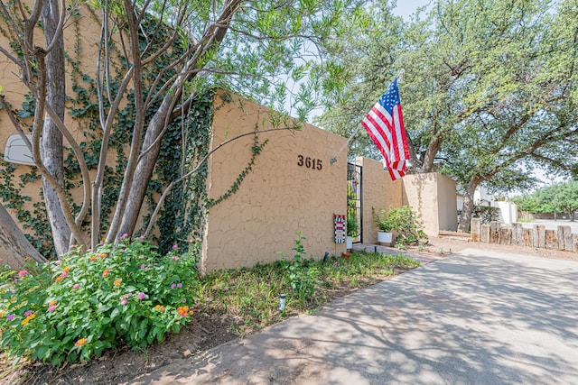 3615 W Wadley Ave, Midland, TX 79707 - view of property exterior with stucco siding and a gate