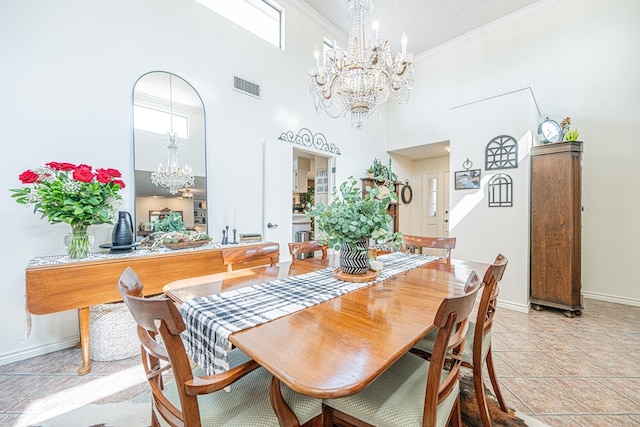 3615 W Wadley Ave, Midland, TX 79707 - dining area with a chandelier, crown molding, and a high ceiling