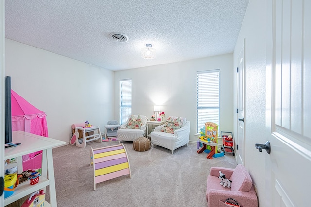 3615 W Wadley Ave, Midland, TX 79707 - game room with healthy amount of natural light, carpet floors, and a textured ceiling
