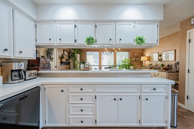 3615 W Wadley Ave, Midland, TX 79707 - kitchen featuring black dishwasher, light countertops, white cabinets, a textured ceiling, and a peninsula